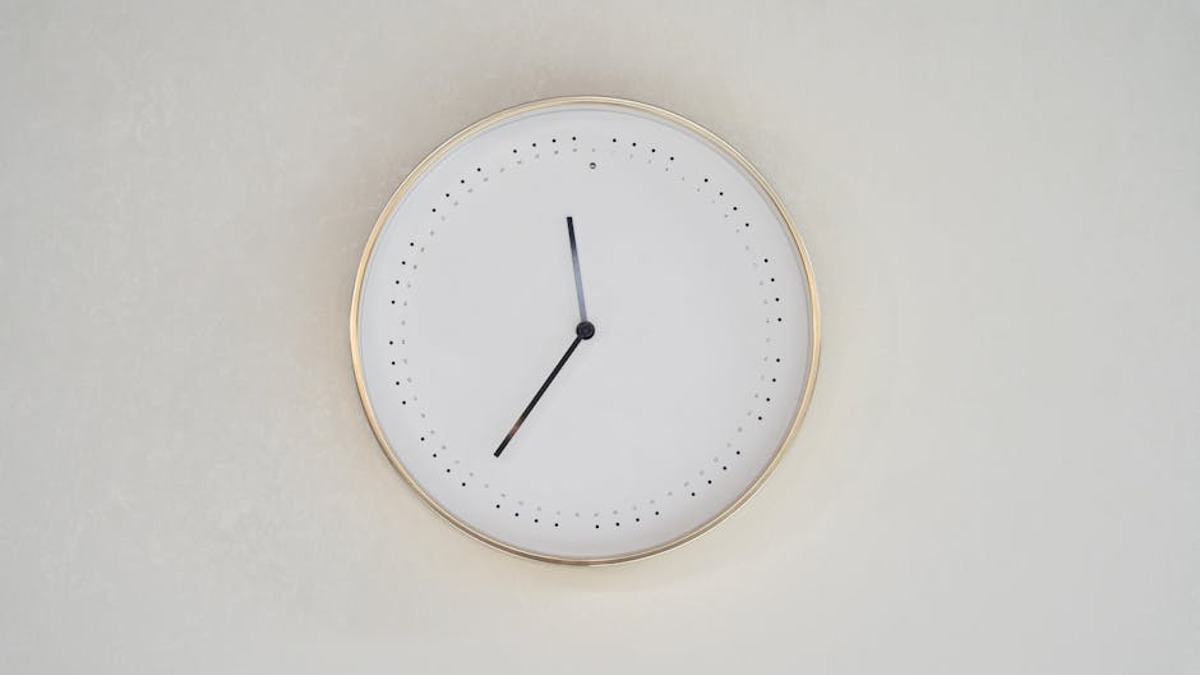 Hand receiving time clock receipt office